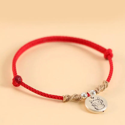 Pulsera trenzada con el signo de la suerte del año del dragón chino hecha a mano en plata de ley 999 de Mythstone 