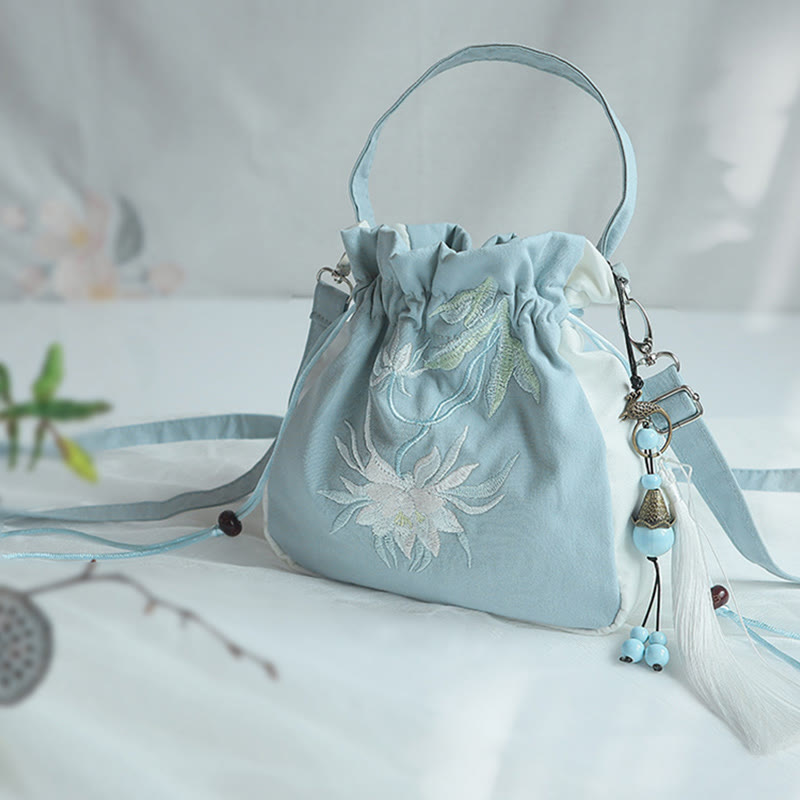 Bolso de mano de lona con flores bordadas a mano de Mythstone