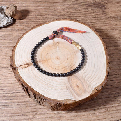 Pulsera de borlas de ónix negro tibetano hecha a mano Mythstone 