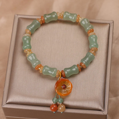 Pulsera de la suerte con diseño de flor de bambú y jade natural de Mythstone