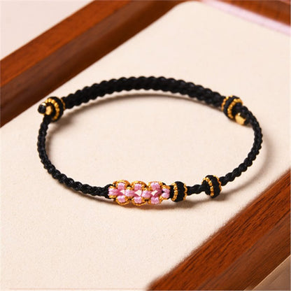 Pulsera trenzada de protección de flor de durazno hecha a mano de Mythstone