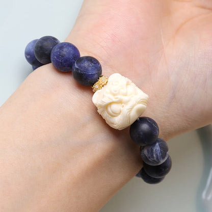 Pulsera de armonía con luna creciente y león danzante de marfil, sodalita y piedra mitológica