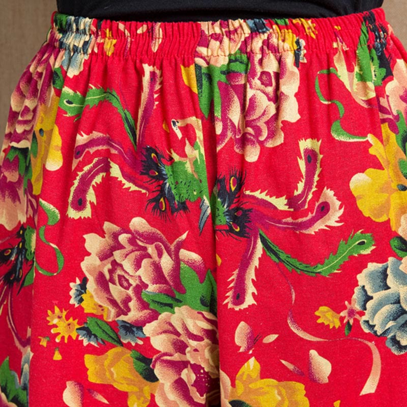 Pantalones harén con estampado de flores rojas y verdes de estilo étnico Mythstone y bolsillos 