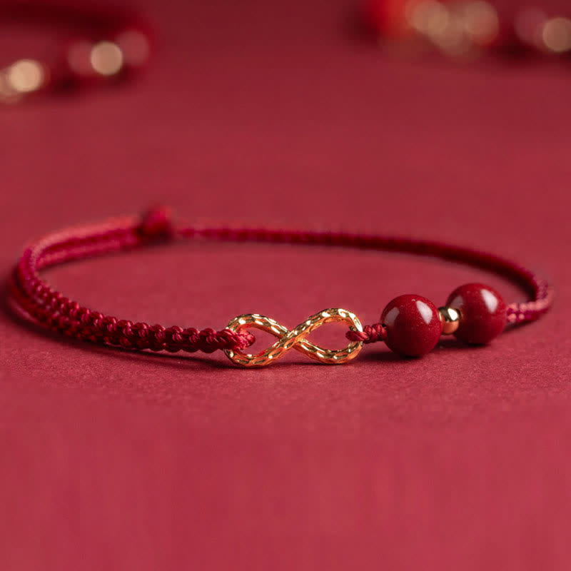 Pulsera tobillera con símbolo del infinito en oro de 14 quilates y hilo rojo con bendición de cinabrio de MythStone