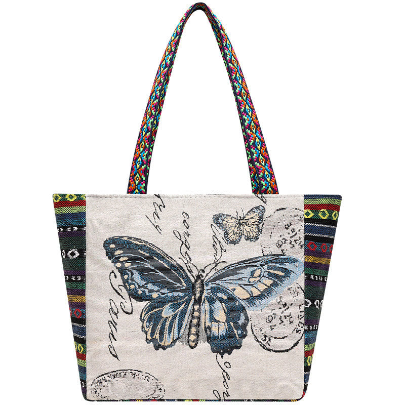 Bolso de mano de lona de gran capacidad con bordado de mariposa y elefante de Mythstone