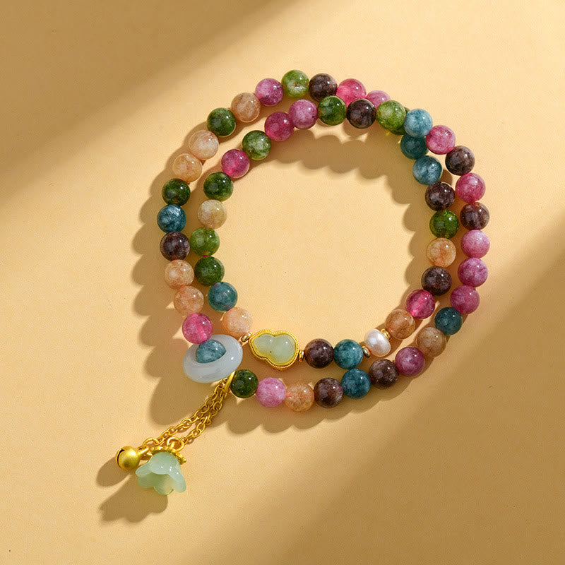 Pulsera con dijes de lirio de los valles y turmalina multicolor de Mythstone