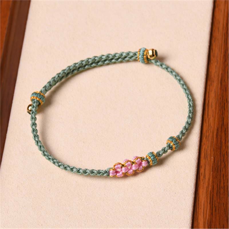 Pulsera trenzada de protección de flor de durazno hecha a mano de Mythstone