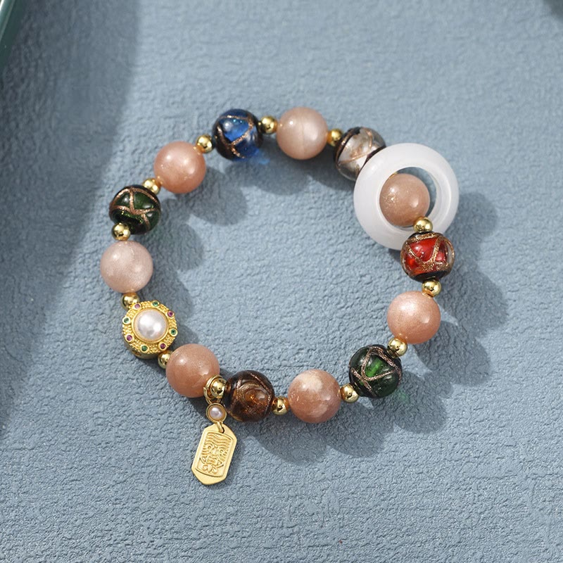 Pulsera con dijes de rueda de oración Om Mani Padme Hum, piedra del sol, piedra Tridacna, vidrio Liuli, incienso tibetano Mythstone