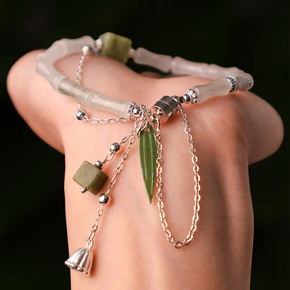 Pulsera con dije de linterna de hoja de bambú y jade blanco natural de plata esterlina 925 de Mythstone