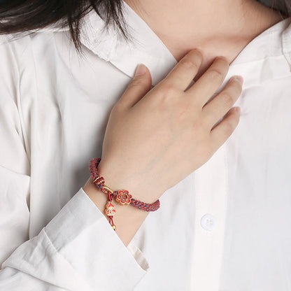 Pulsera trenzada de protección con flores de calabaza de colores hecha a mano de Mythstone