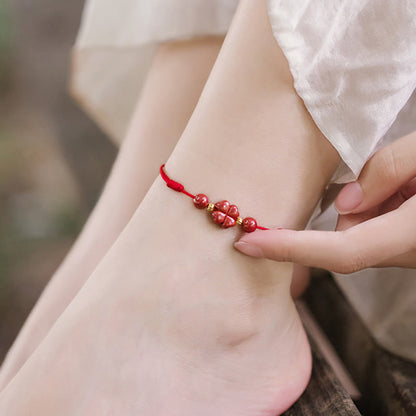 Pulsera de tobillo con trébol de cuatro hojas y cinabrio que bendice la calma