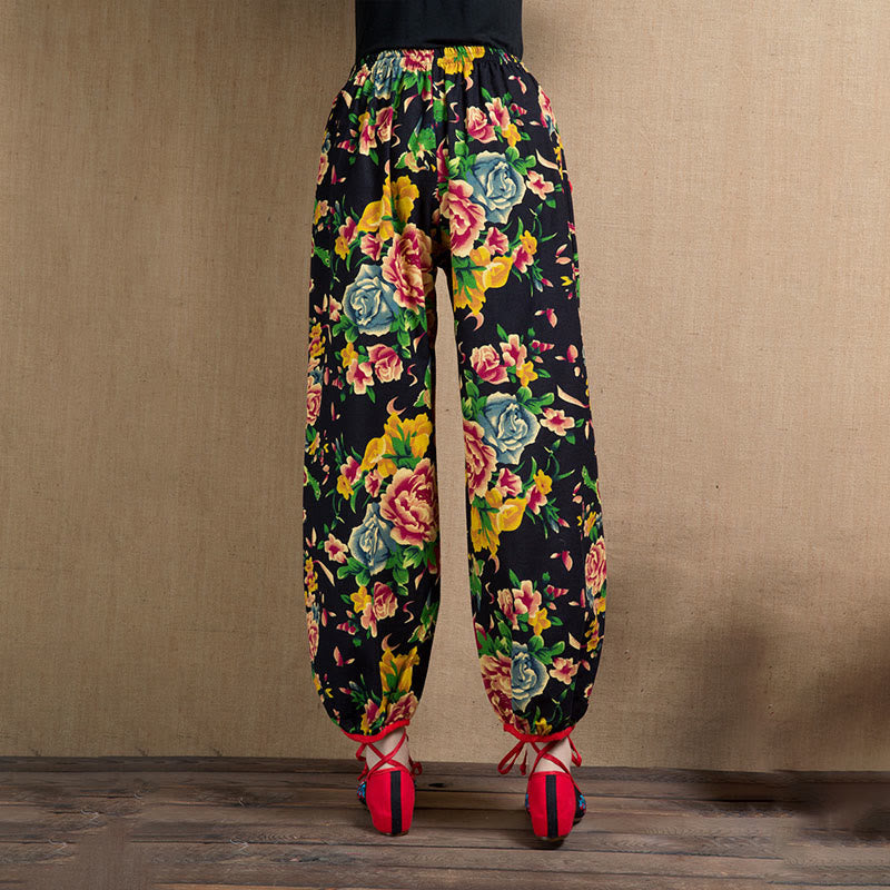 Pantalones harén con estampado de flores rojas y verdes de estilo étnico Mythstone y bolsillos 