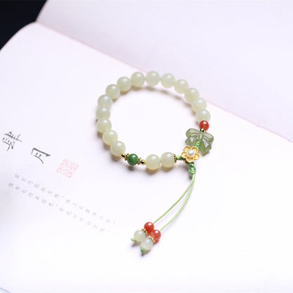 Pulsera de plata de ley 925 con diseño de mariposa y flor de la suerte de jade de Mythstone