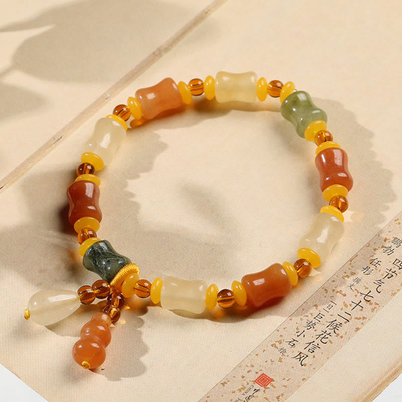 Pulsera con dije de riqueza de calabaza de jade de seda dorada natural Mythstone 