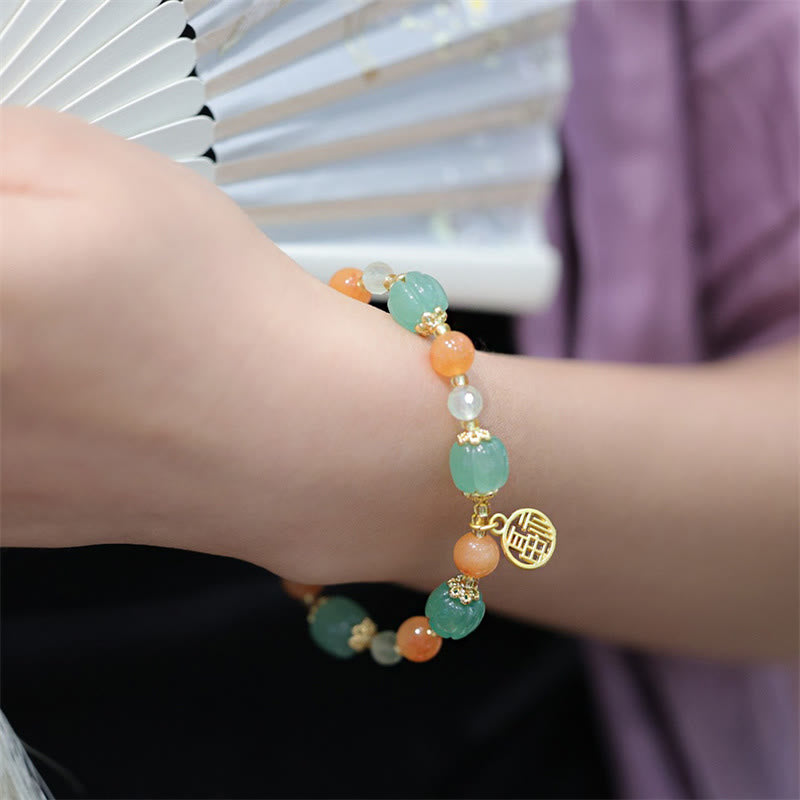 Pulsera de la riqueza con abalorios de calabaza de jade y seda dorada natural de Mythstone 