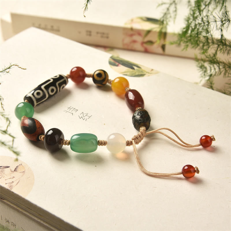 Pulsera de protección de riqueza de ágata con cuentas Dzi tibetanas de nueve ojos Mythstone 