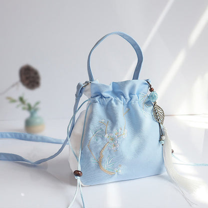 Bolso de mano de lona con flores bordadas a mano de Mythstone