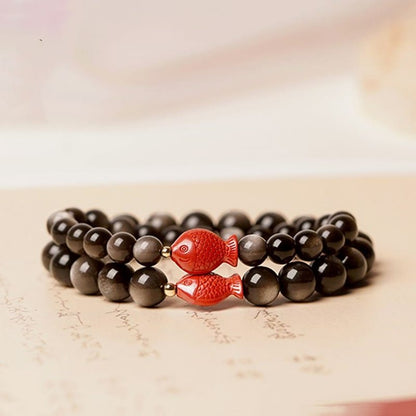 Pulsera protectora calmante con pez koi de obsidiana cinabrio con brillo plateado natural Mythstone 