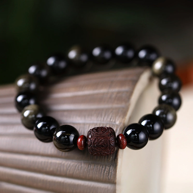 Pulsera curativa con personaje Om Mani Padme Hum Fu y obsidiana arcoíris con brillo dorado natural de Mythstone 