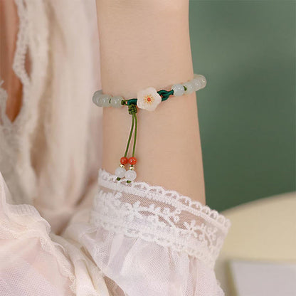 Pulsera de la suerte con flor de durazno y jade de Mythstone