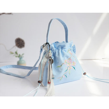 Bolso de mano de lona con flores bordadas a mano de Mythstone