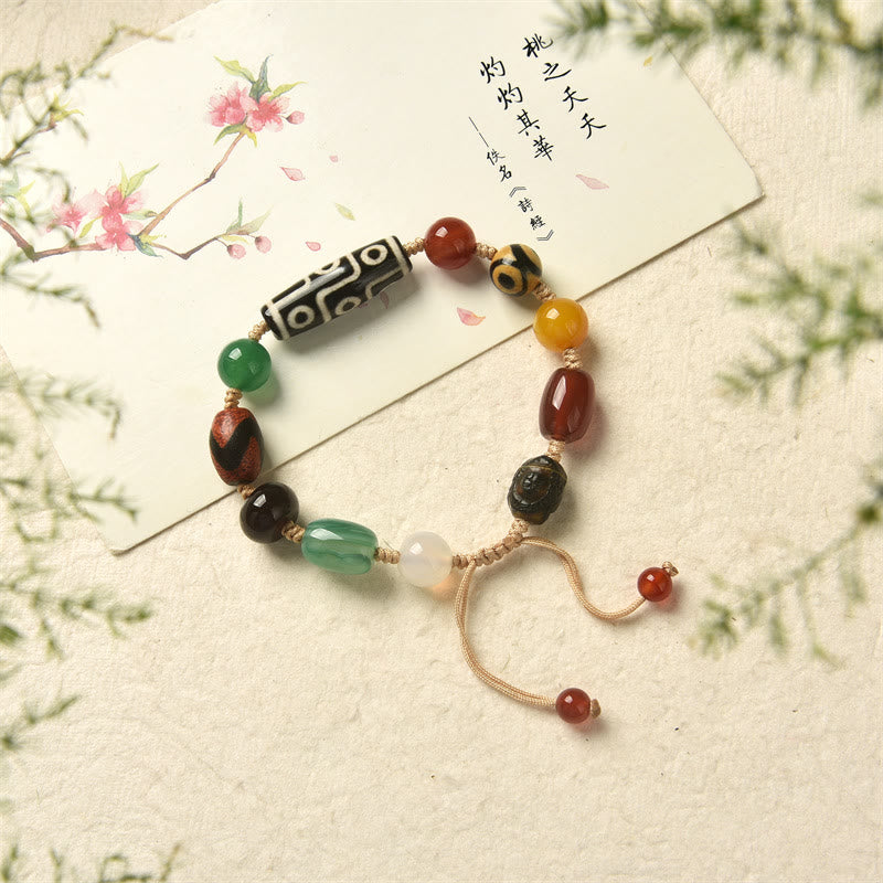 Pulsera de protección de riqueza de ágata con cuentas Dzi tibetanas de nueve ojos Mythstone 