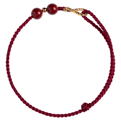 Pulsera tobillera con símbolo del infinito en oro de 14 quilates y hilo rojo con bendición de cinabrio de MythStone