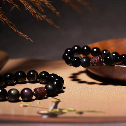 Pulsera curativa con personaje Om Mani Padme Hum Fu y obsidiana arcoíris con brillo dorado natural de Mythstone 