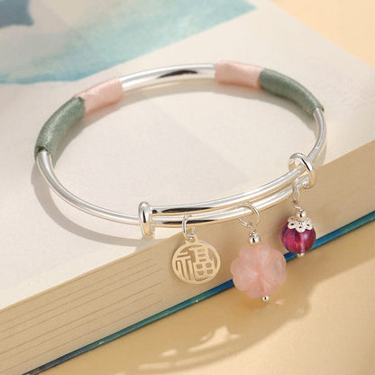 Pulsera brazalete con hebilla de paz y flor de la suerte con cristal rosa Mythstone 