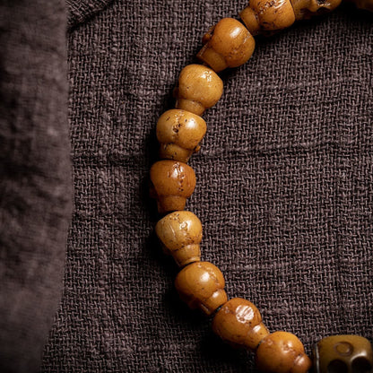 Pulsera de fuerza con diseño de El Señor del Bosque Cadáver y Hueso de Yak Tibetano de Mythstone