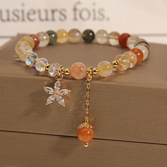 Pulsera de cuarzo rutilado multicolor con circonitas auspiciosas y flor de Mythstone