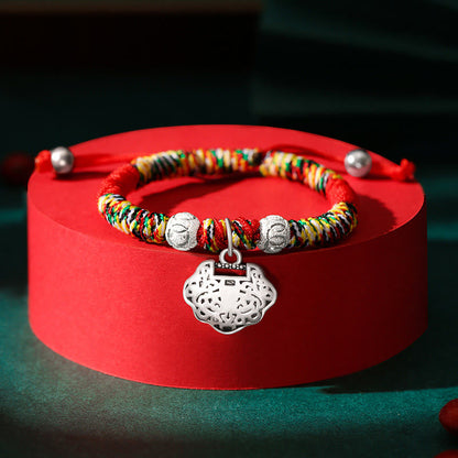 Pulsera trenzada hecha a mano para niños con dije de candado chino en plata de ley 925 de Mythstone con hilo rojo multicolor