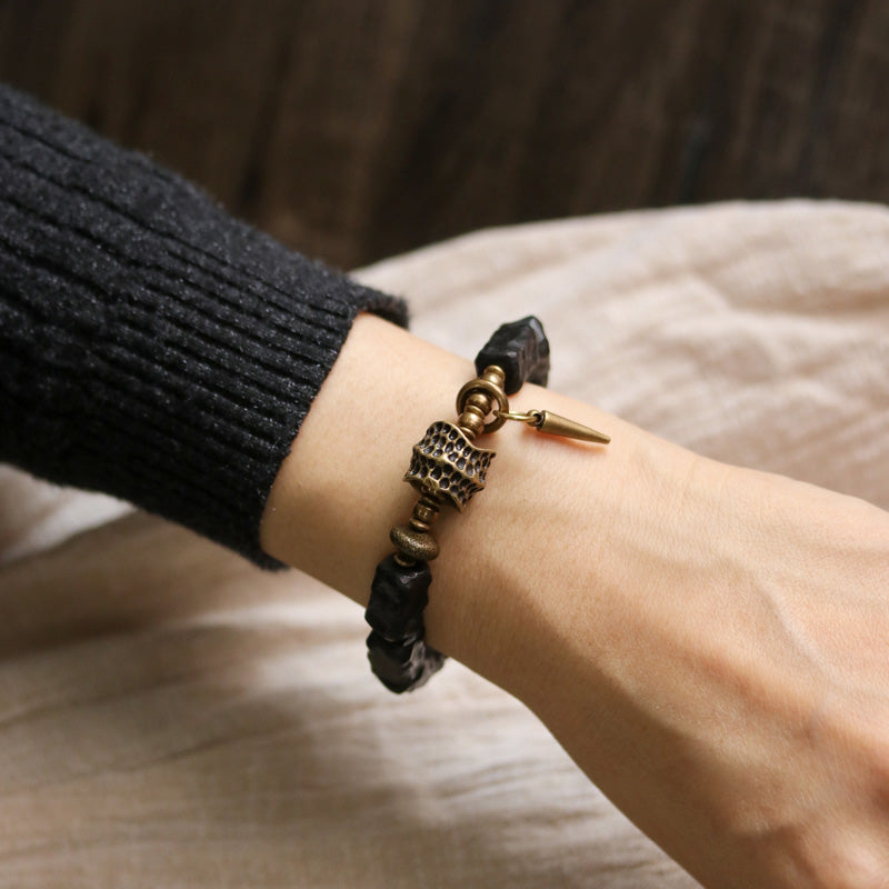 Pulsera de pareja con protección del equilibrio de cobre y madera de ébano Mythstone