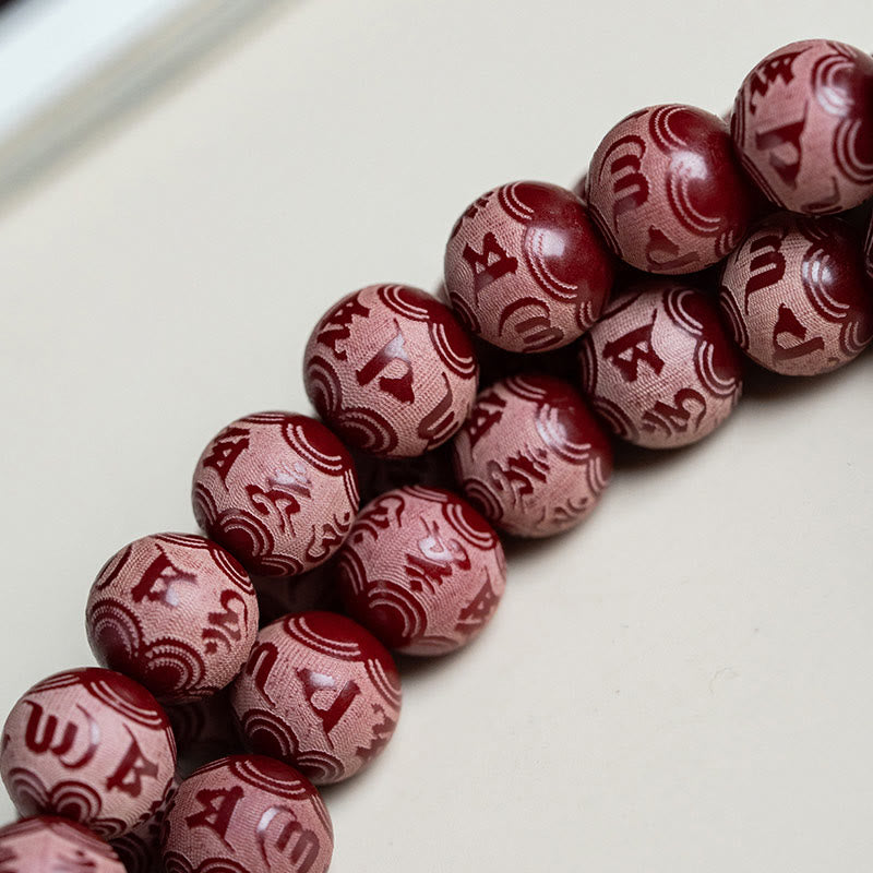 Pulsera de armonía grabada con semilla de bodhi roja de Mythstone Om Mani Padme Hum Lotus 