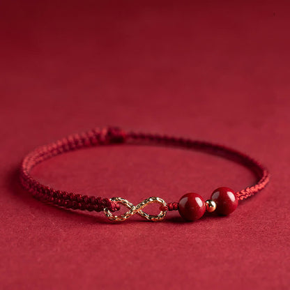 Pulsera tobillera con símbolo del infinito en oro de 14 quilates y hilo rojo con bendición de cinabrio de MythStone