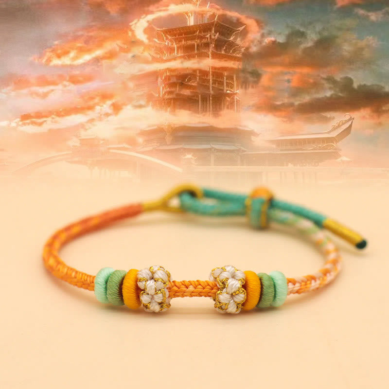 Pulsera trenzada de cuerda de la suerte con nudo de la paz y flor de durazno de ocho hilos hecha a mano de Mythstone 