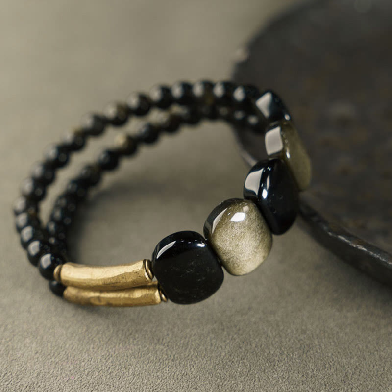 Pulsera reforzada con obsidiana negra y brillo dorado de Mythstone 