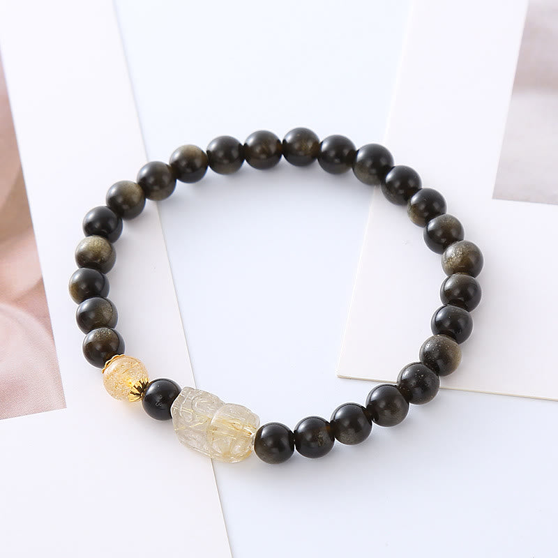 Pulsera de protección de riqueza PiXiu con obsidiana y brillo dorado natural de Mythstone