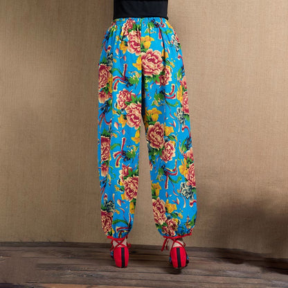 Pantalones harén con estampado de flores rojas y verdes de estilo étnico Mythstone y bolsillos 