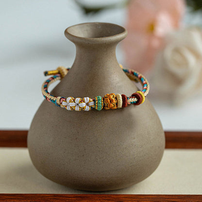 Pulsera trenzada con diseño de flor de durazno en color Dunhuang hecha a mano de Mythstone 