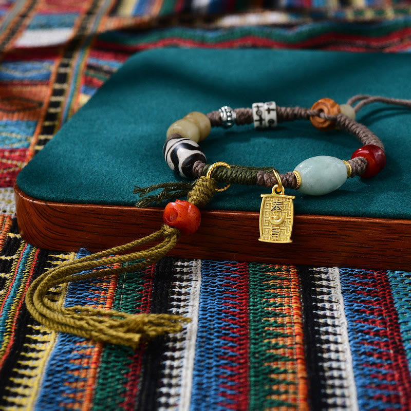 Pulsera de cuerda de la riqueza con cuentas tibetanas Dzi y hueso de yak de ágata