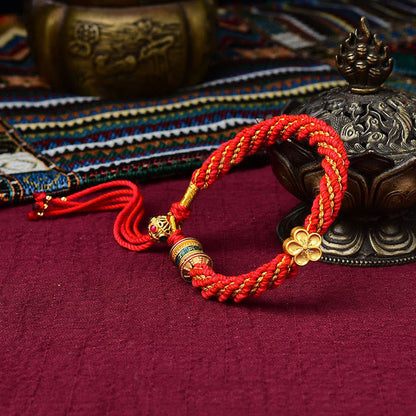 Pulsera de hilo tejido con amuleto Thangka de los cinco dioses de la riqueza y la suerte hecha a mano con forma de rueda de oración y flores de Mythstone Tibet