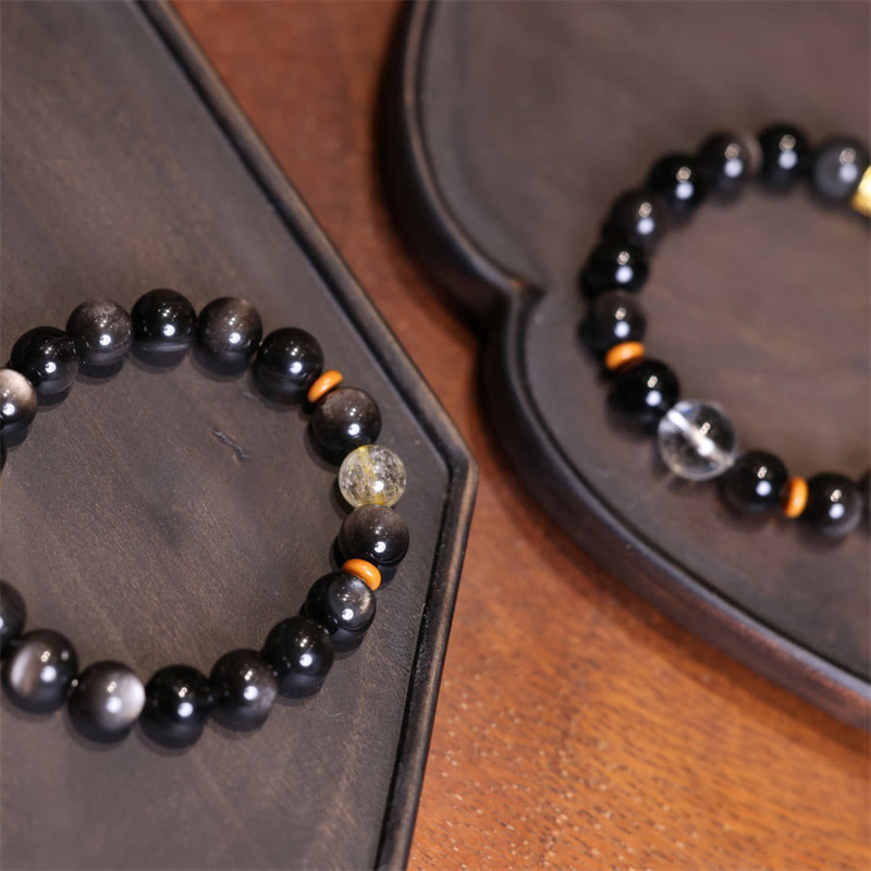 Pulsera protectora con cuentas de obsidiana de plata natural y brillo Om Mani Padme Hum de Mythstone