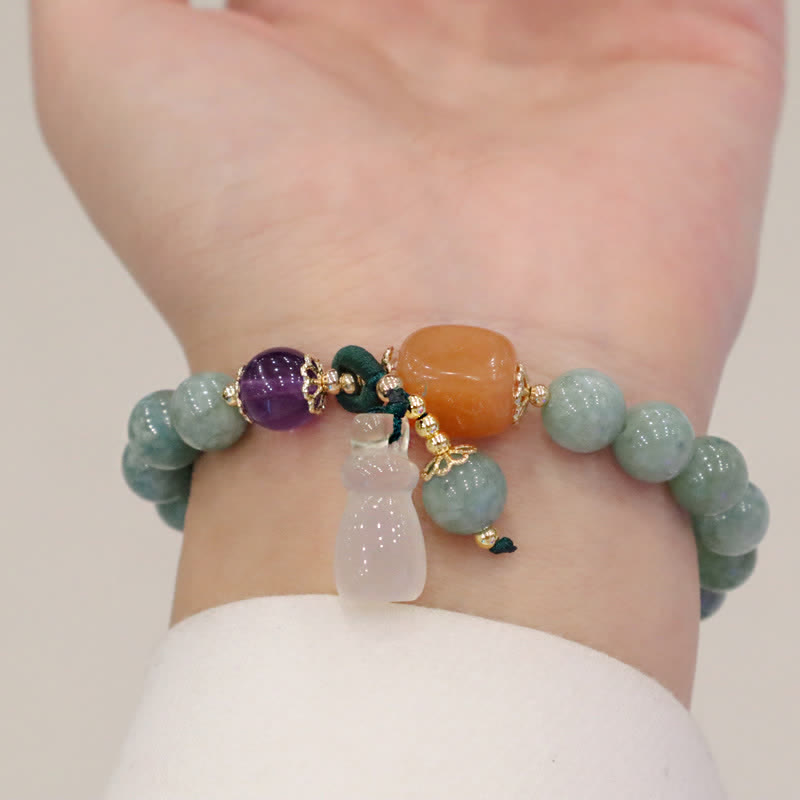 Pulsera curativa de cristal de amatista con hebilla de paz y loto de jade cian y calabaza Mythstone