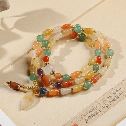 Pulsera de la riqueza con calabaza de jade y seda dorada Mythstone 