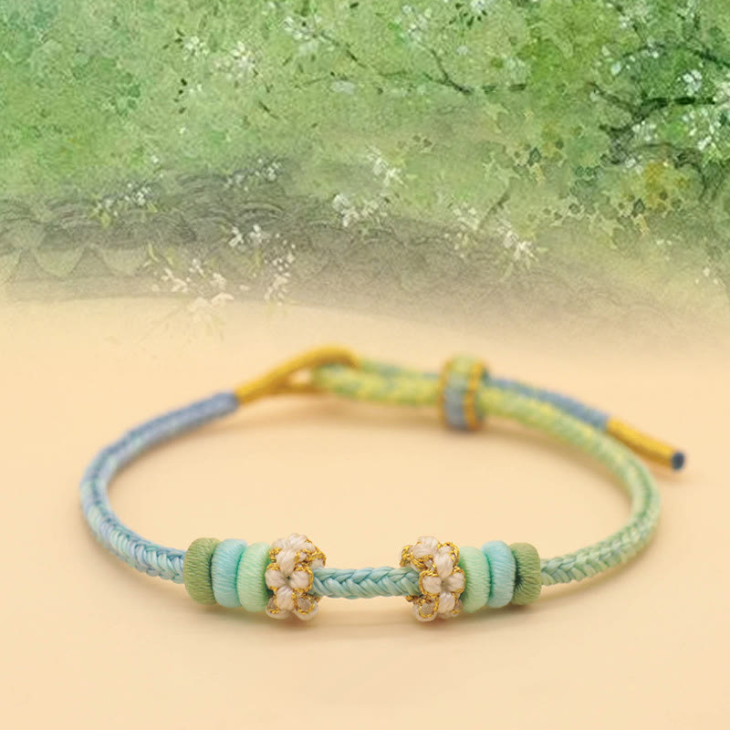 Pulsera trenzada de cuerda de la suerte con nudo de la paz y flor de durazno de ocho hilos hecha a mano de Mythstone 