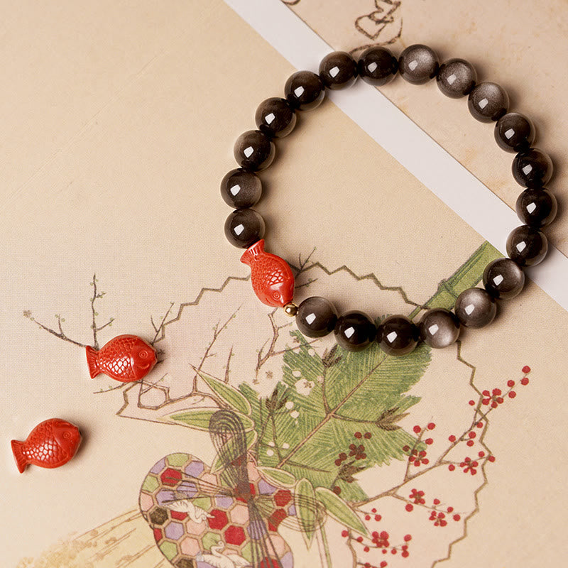 Pulsera protectora calmante con pez koi de obsidiana cinabrio con brillo plateado natural Mythstone 