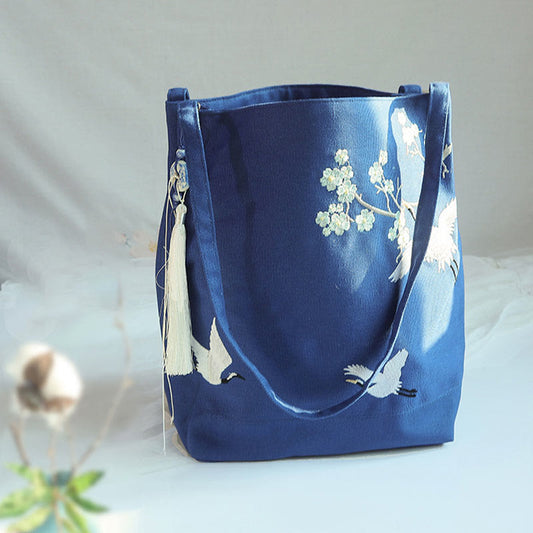 Bolso de mano de lona de gran capacidad con bordado de flores de ciruelo y grulla de Mythstone