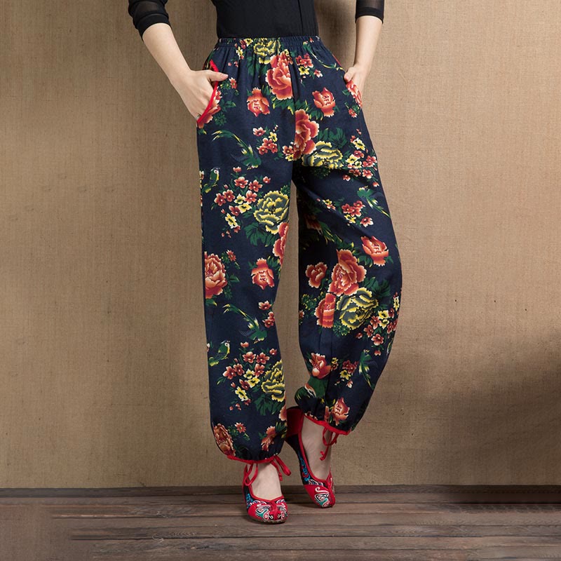 Pantalones harén con estampado de flores rojas y verdes de estilo étnico Mythstone y bolsillos 