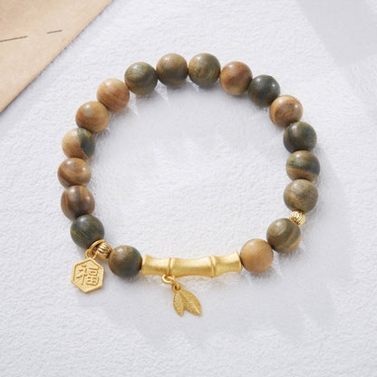 Pulsera relajante de bambú con personaje Fu de sándalo verde Mythstone